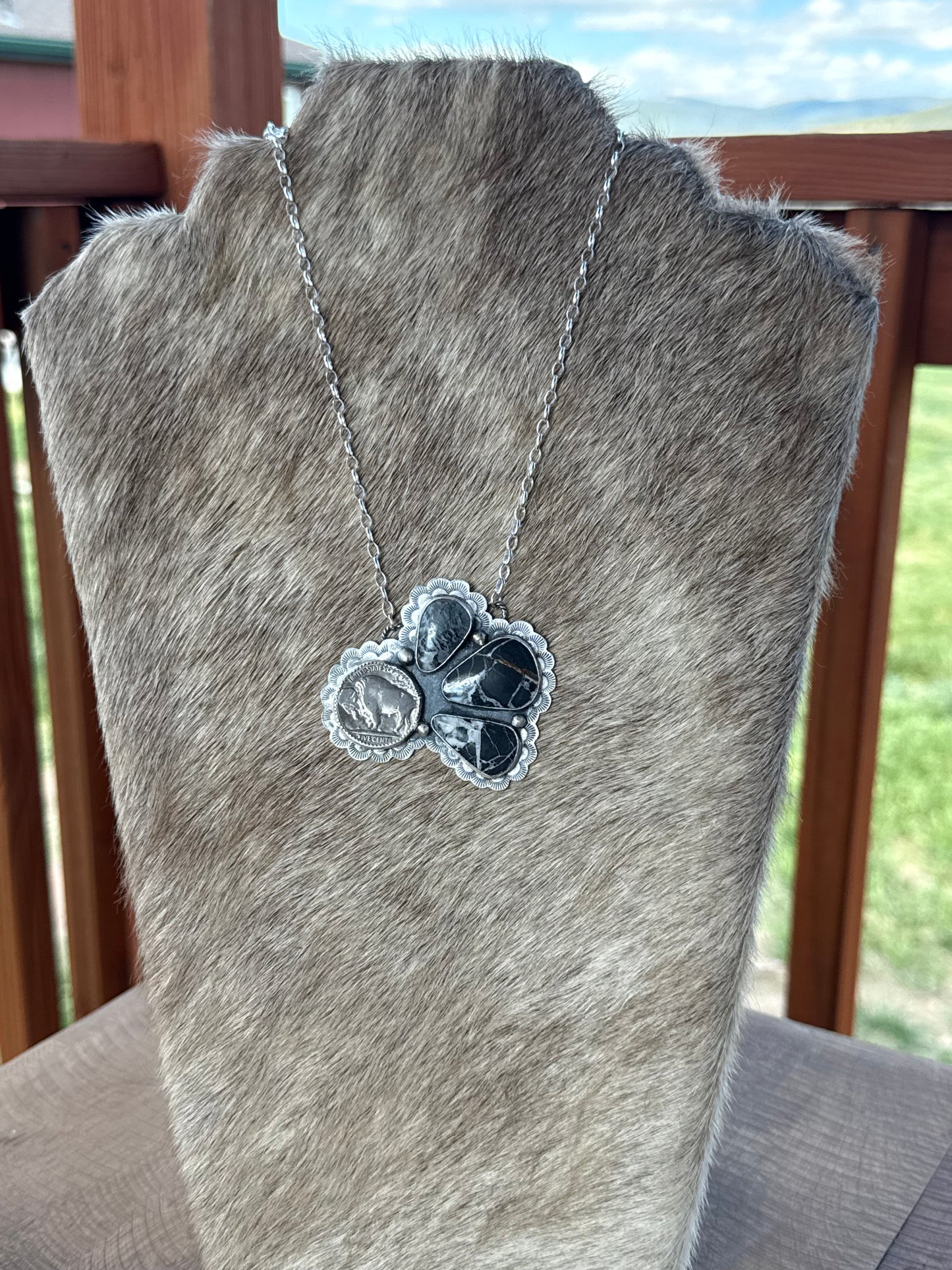 White Buffalo and coin necklace