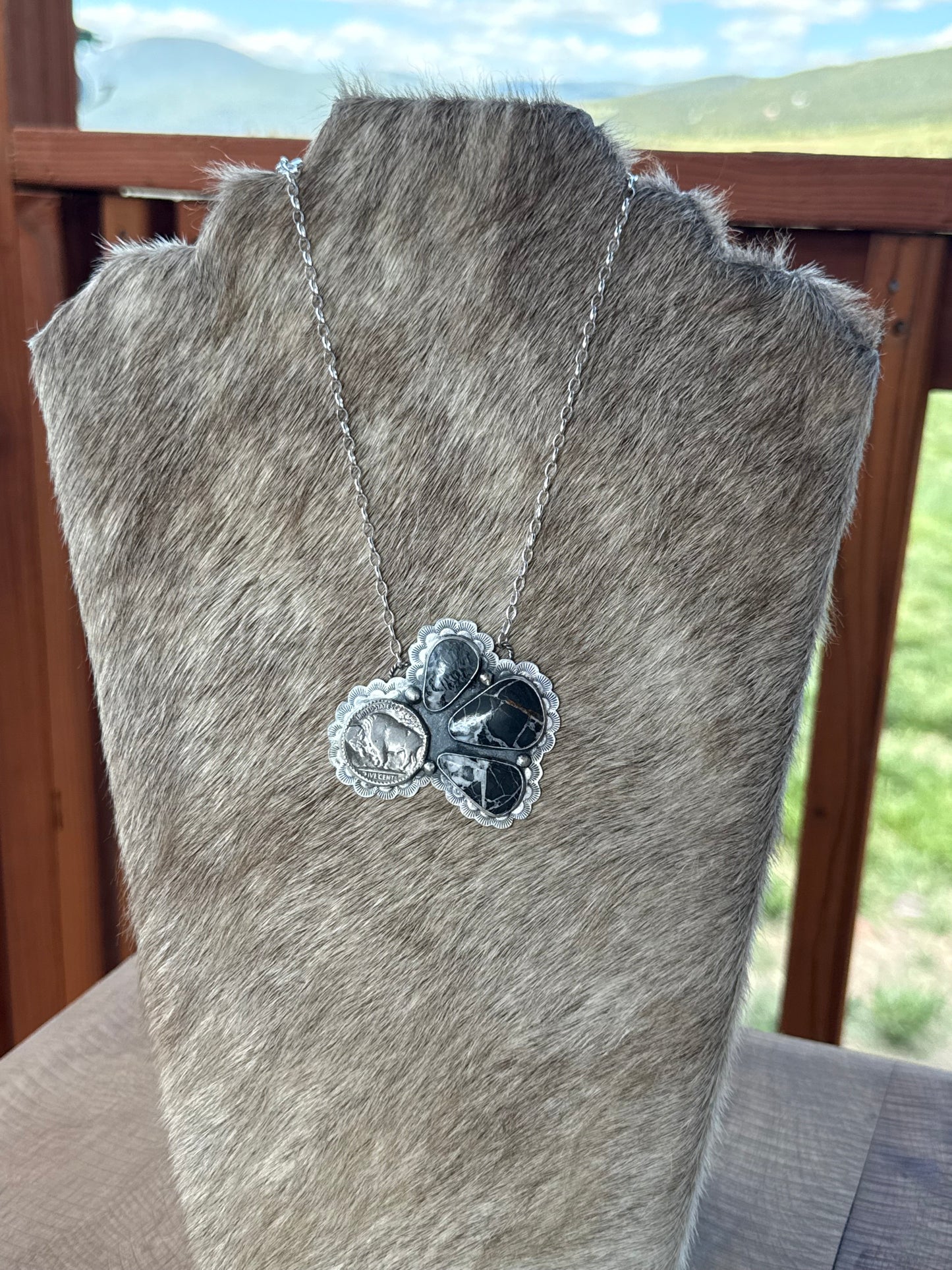 White Buffalo and coin necklace